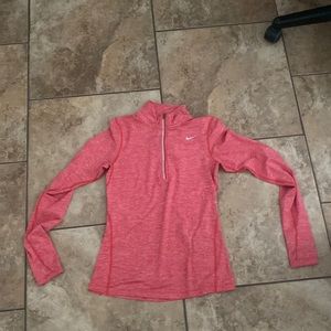 a pink Nike woman’s small dry fit running quarter zip